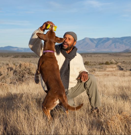Casual,African,American,Man,Playing,With,His,Dog,Outdoors